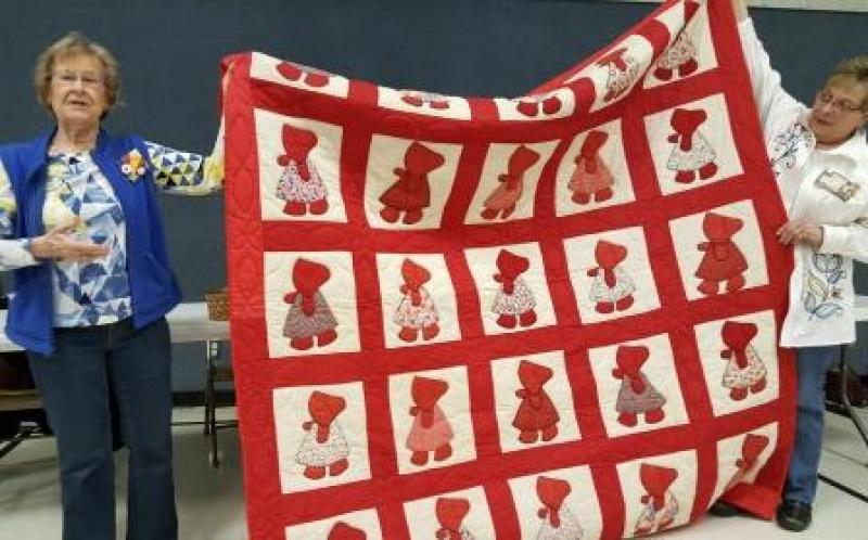Wanda gives the history of this Sunbonnet Sue quilt with vintage blocks, finished in 1960s. It will be a raffle quilt for The Legacy of the Plains museum.